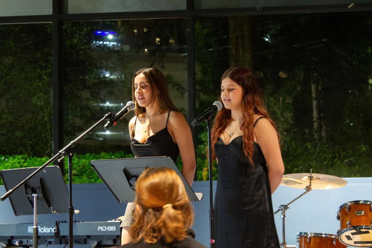 Eve Gujral and Sofia Núñez perform a duet together. The "So Big, So Small" cabaret event hosted by NU Stage gave new members the opportunity to get involved by pairing up with a senior member of the club.